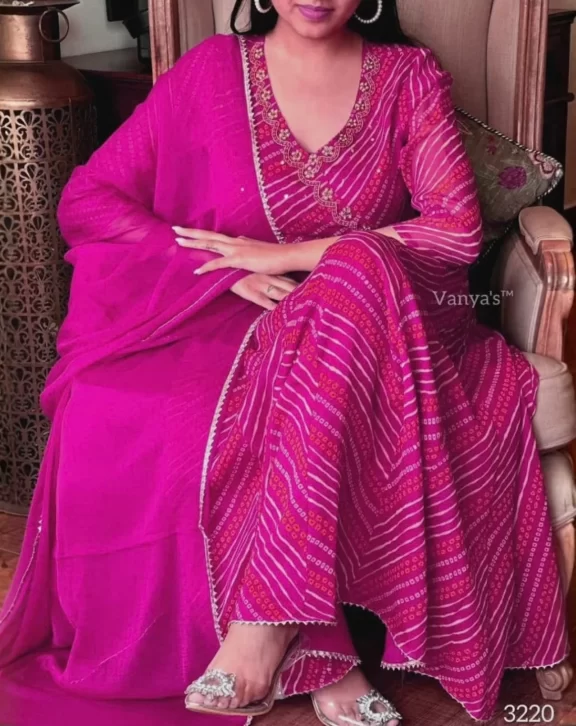 Beautiful Bandhej Anarkali 3-piece suit set crafted from pure 60/60 cotton fabric, featuring heavy Zardozi handwork on the Kurti and a stylish Nazmin dupatta. Perfect for festive and traditional occasions. Kurti Length: 48 inchesPant Length: 39 inchesDupatta: 2.25 meters Fabric Pure Cotton 60/60 Colour - Red and Pink Bandej
