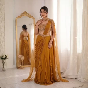 Elegant Fancy Lehenga Choli crafted with Rangoli fabric, featuring a beautifully embroidered Banglori blouse, fancy latkan lace dupatta, and a graceful 3.5-meter flair. Perfect for weddings, festive occasions and parties. Lehenga Fabric: Rangoli FabricLehenga Flair: 3.5 MeterBlouse Fabric: BangloriBlouse: Fully StitchedBlouse Work: Embroidery & Sequin WorkSleeves: Long SleevesDupatta: Heavy Rangoli FancyDupatta Work: Latkan LaceWeight: 1 KgColor: Mustard / Yellow Package Includes 1 Lehenga 1 Fully Stitched Blouse 1 Dupatta