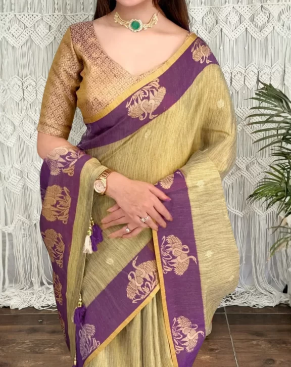 Graceful Pure Cotton Silk Saree featuring rich zari jacquard weaving, a beautifully detailed pallu, contrast jacquard border, and elegant fancy tassels. A timeless ethnic piece for festive and special occasions. Saree Details Design: Hanshini 👑Fabric: Pure Cotton SilkLength: 6.4 MeterBlouse: Running BlousePattern: Zari Jacquard WeavingBorder: Contrast Jacquard WeavingPallu: Rich Jacquard Pallu with TasselsPrice: ₹1,599/- Package Includes 1 Pure Cotton Silk Saree 1 Running Blouse Piece